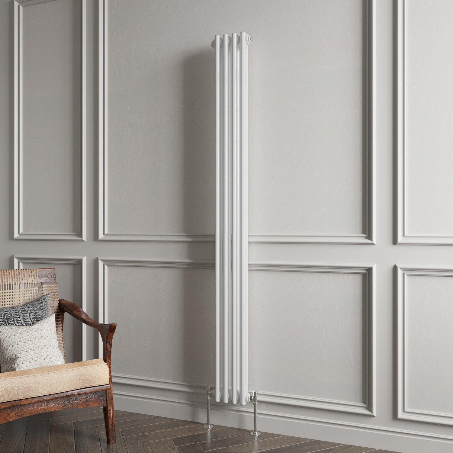 White vertical radiator against a gray paneled wall with a wooden chair.