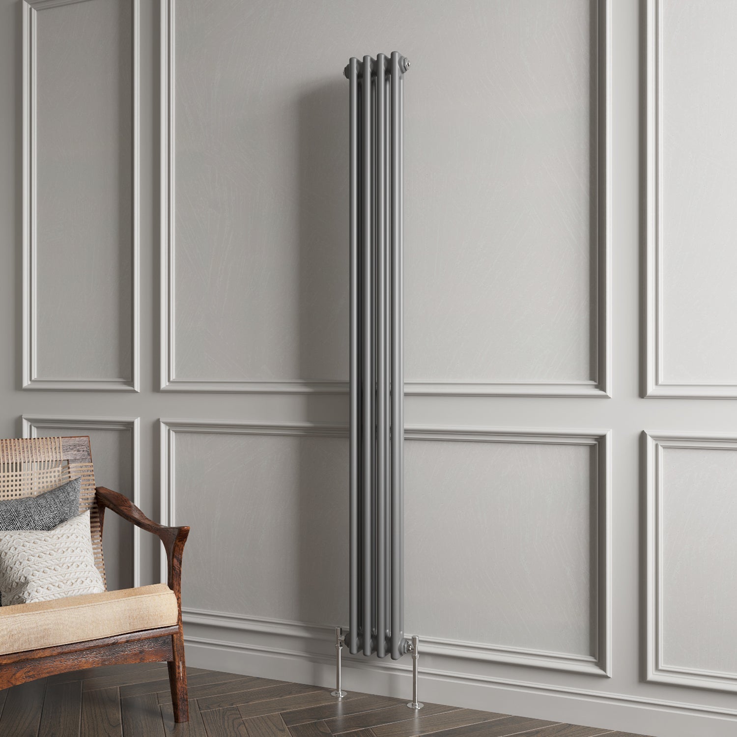Vertical radiator against a gray paneled wall with a wooden chair.