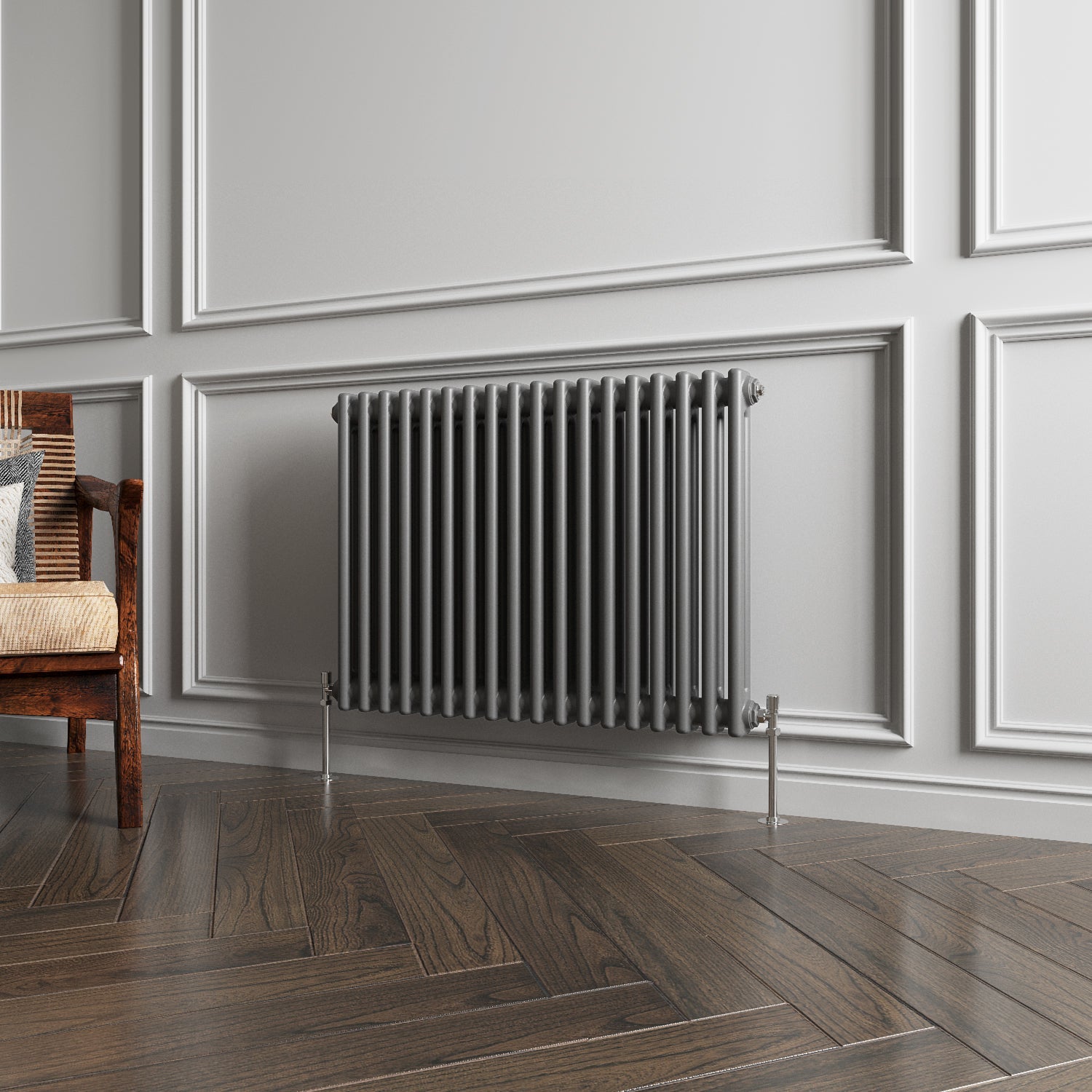 Gray radiator on a wall with wooden flooring and a chair in the corner.