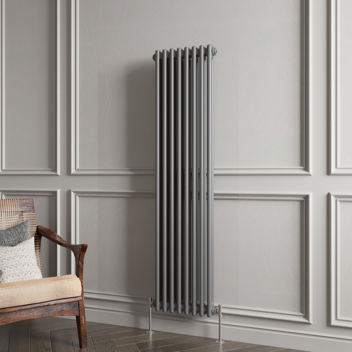 Vertical radiator against a gray paneled wall with a wooden chair.