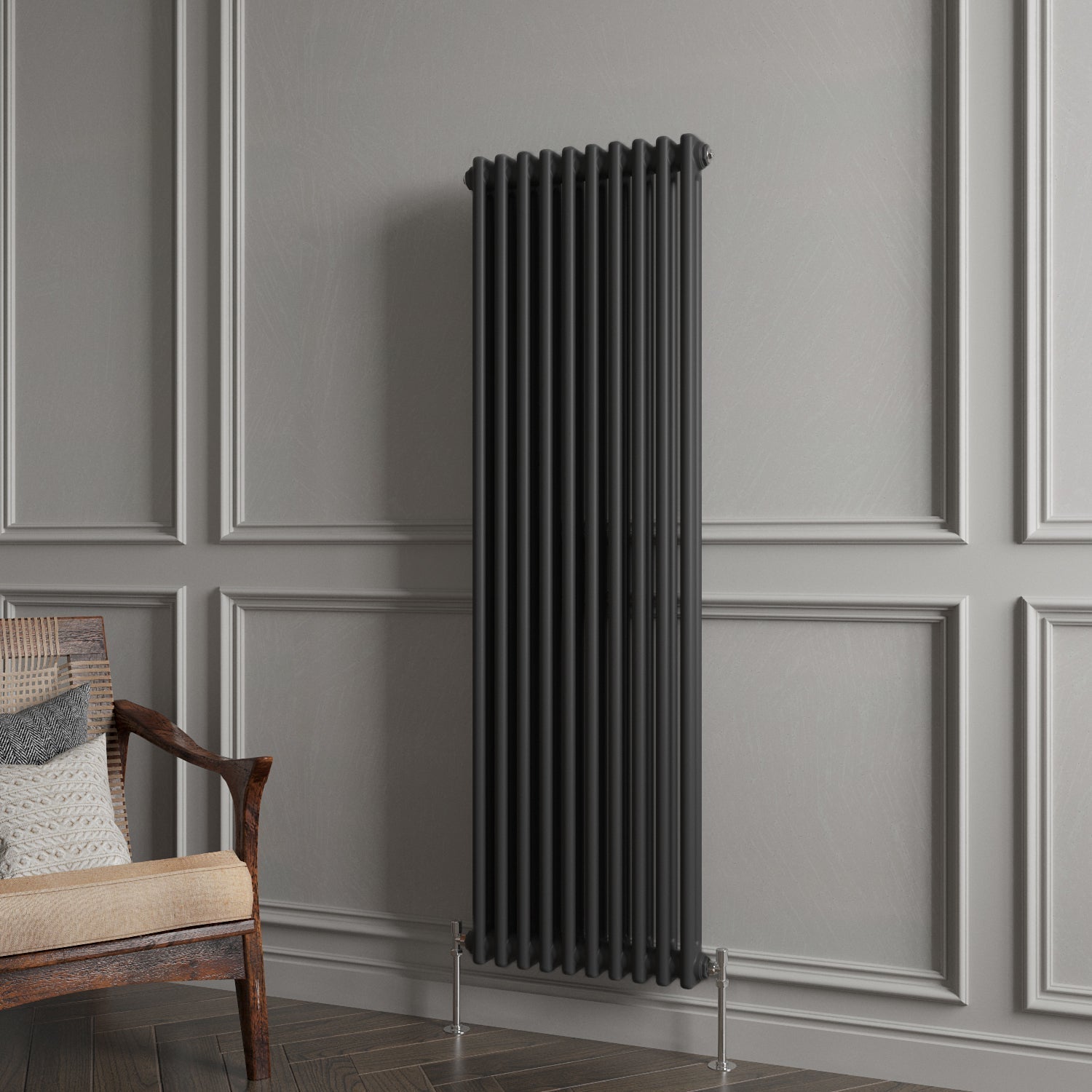 Decorative vertical radiator against a gray paneled wall with a wooden chair.