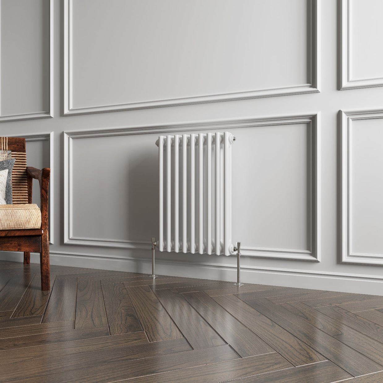 White radiator on a wall with wooden flooring and a chair.
