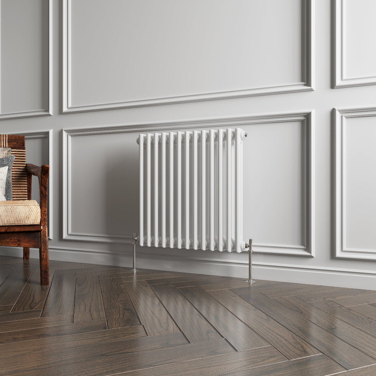 White radiator on a gray paneled wall with wooden flooring
