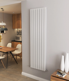 Vertical radiator on a wall in a modern living room with a dining area. hallway radiator. kitchen.
