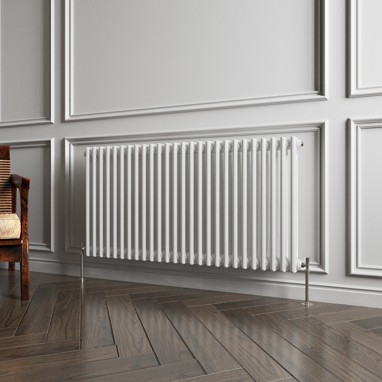 White radiator on a gray wall with wooden flooring